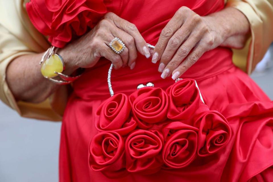 Karen Smith found her rose purse on Temu for Kentucky Derby 150 at Churchill Downs in Louisville, Ky., Saturday, May 4, 2024. It went with her red and gold outfit. Her nails were done by Nail Envogue in Lexington.