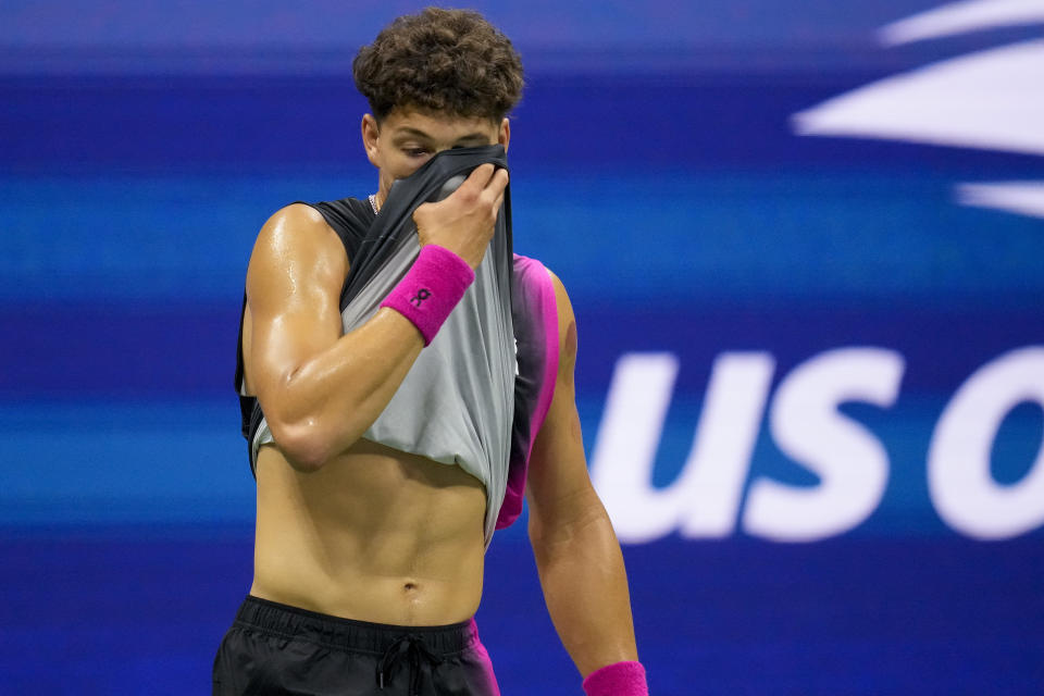 Ben Shelton, of the United States, wipes sweat from his face between points of a game against Frances Tiafoe, of the United States, during the quarterfinals of the U.S. Open tennis championships, Tuesday, Sept. 5, 2023, in New York. (AP Photo/Charles Krupa)