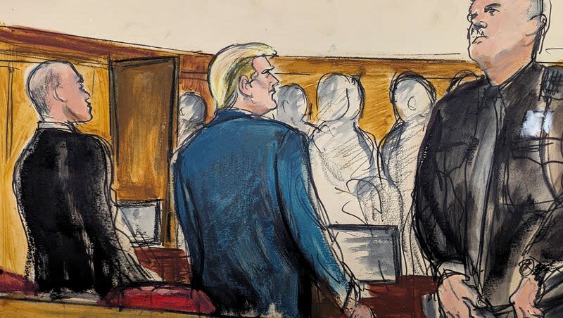 Former President Donald Trump stands as the jury files into the courtroom at the start of the trial in Manhattan criminal court on Monday, April 22, 2024, in New York.