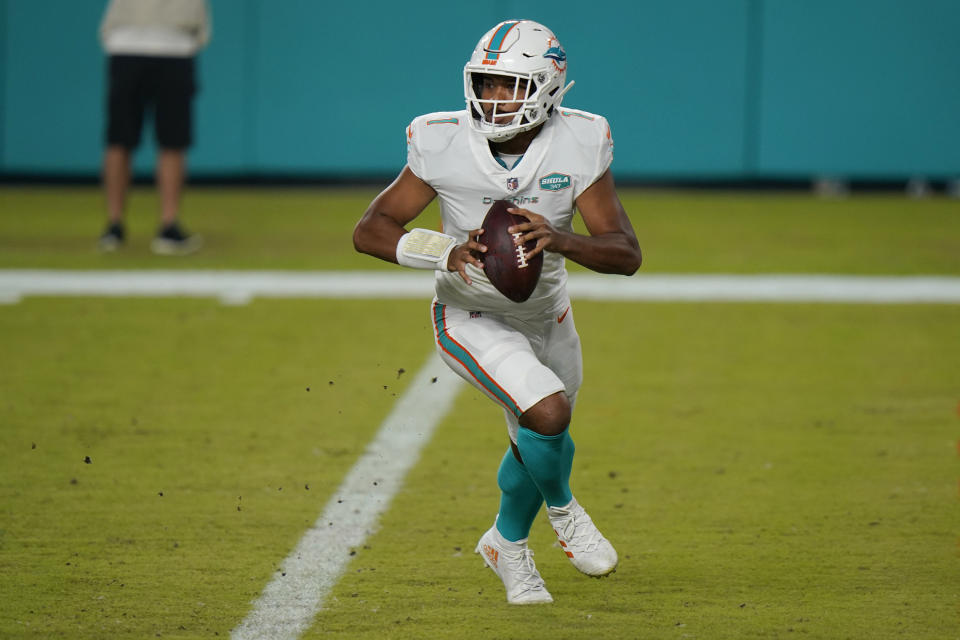 Miami Dolphins quarterback Tua Tagovailoa (1) looks to pass the ball during the second half of an NFL football game against the New York Jets, Sunday, Oct. 18, 2020, in Miami Gardens, Fla. Hopes are high Tagovailoa will be the best of the 22 quarterbacks to start for Miami since Dan Marino retired following the 1999 season. (AP Photo/Lynne Sladky)