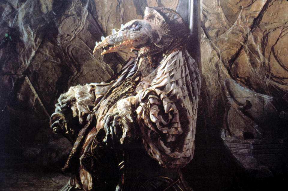 Skeksi sitting on a throne