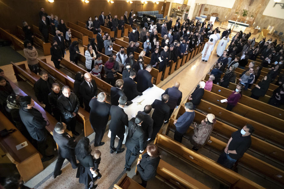 FILE - The casket containing the body of Valentino Alvero arrives at St. Stephen Catholic Church for a burial Mass in Monterey Park, Calif., on Friday, Feb. 3, 2023. A 72-year-old man opened fire on a mostly elderly crowd at a Lunar New Year dance, killing 11 people and wounding nine. The man later died of an apparent self-inflicted gunshot wound. The massacre has been called the deadliest shooting in Los Angeles County history. (David Crane/The Orange County Register via AP, File)