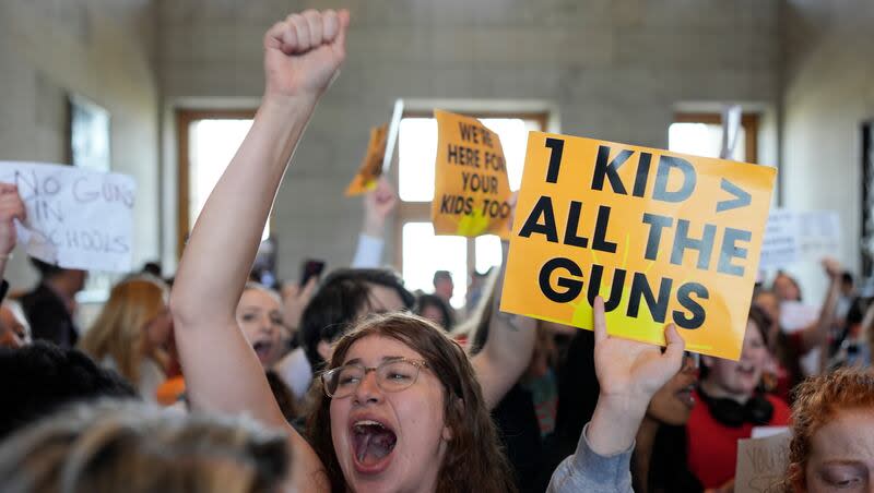 Emmie Wolf-Dubin, center, yells during a protest outside the House chamber after legislation passed that would allow some teachers to be armed in schools during a legislative session, Tuesday, April 23, 2024, in Nashville, Tenn.