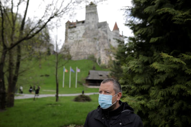 Alexandru Priscu, Bran Castle's marketing director, looks on during interview with Reuters reporter