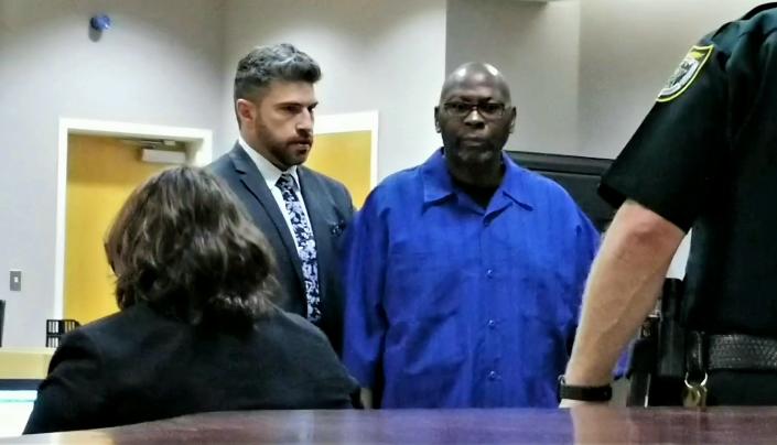 Willie Shorter (right) stands with attorney Daniel Martinez during his first court appearance in 2019. Shorter faces 8 years in prison under a plea deal with the state after police said he impregnated a woman with severe developmental disabilities while working as her caregiver at a Rockledge group home in early 2015.