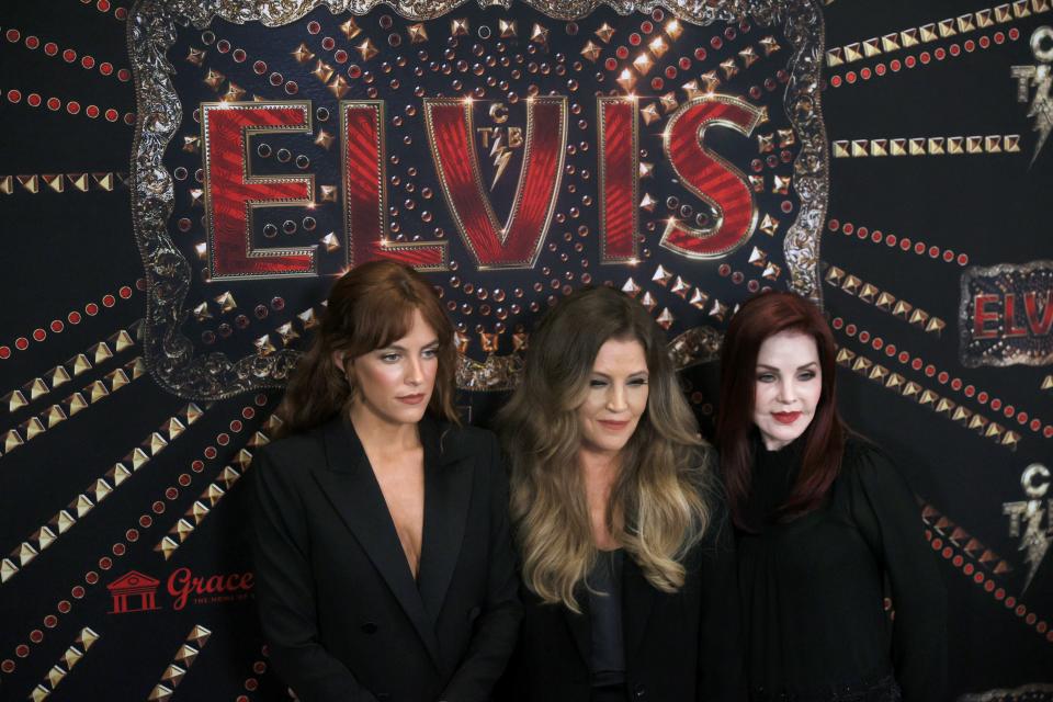 Riley Keough, from left, Lisa Marie Presley and Priscilla Presley greet the press during a red carpet event before the screening for the new biopic movie 'Elvis' at Graceland in Memphis, Tenn. on Saturday, June 11, 2022. 