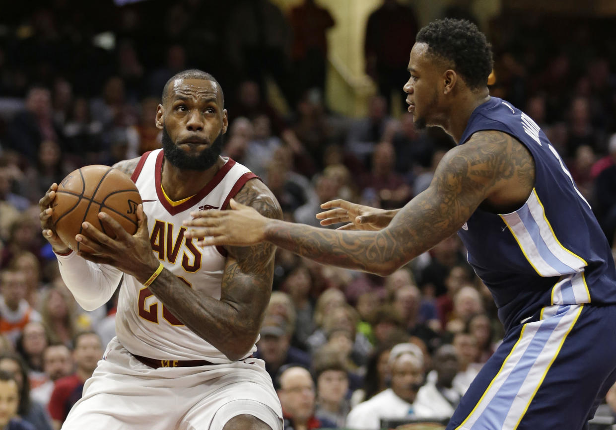 LeBron James scored Cleveland’s final 13 points to pull out a victory over the Memphis Grizzlies but that may have just been so he could catch the end of Ohio State’s game. (AP Photo)