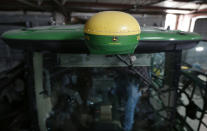 Nick Guetterman climbs into a crop sprayer equipped with GPS and digital uplink while on his farm near Bucyrus, Kan., Wednesday, Feb. 19, 2014. Information uplinked from the farm implement is available via the cloud to computers and mobile devices on the farm. Farmers from across the nation gathered in Washington this month for their annual trek to seek action on the most important matters in American agriculture. But this time, a new issue emerged: growing unease about how the largest seed companies are gathering vast amount of data from sensors on tractors, combines and other farm equipment. The sensors measure soil conditions, seeding rates, crop yields and many other variables. (AP Photo/Orlin Wagner)