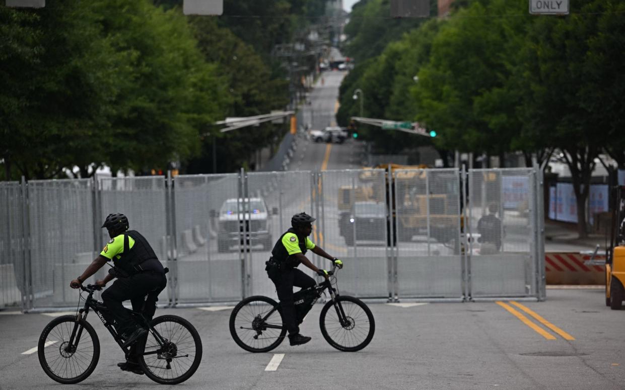 Police patrol a closed off street near the debate centre