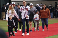 Atlanta Braves' Freddie Freeman, his wife Chelsea and son Charlie arrive during a celebration at Truist Park, Friday, Nov. 5, 2021, in Atlanta. The Braves beat the Houston Astros 7-0 in Game 6 on Tuesday to win their first World Series MLB baseball title in 26 years. (AP Photo/John Bazemore)