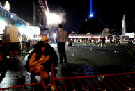 <p>People take cover at the Route 91 Harvest country music festival after apparent gun fire was heard on Oct. 1, 2017 in Las Vegas. (Photo: David Becker/Getty Images) </p>