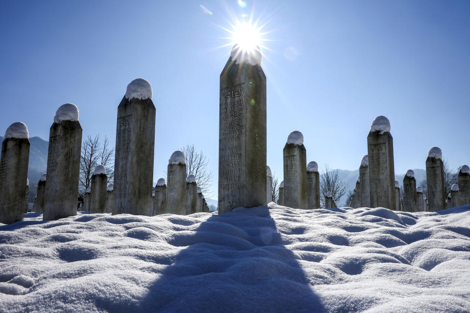 Snow caps the monuments at the Srebrenica Memorial Center in Potocari, Bosnia, Monday, Jan. 22, 2024. (AP Photo/Armin Durgut)