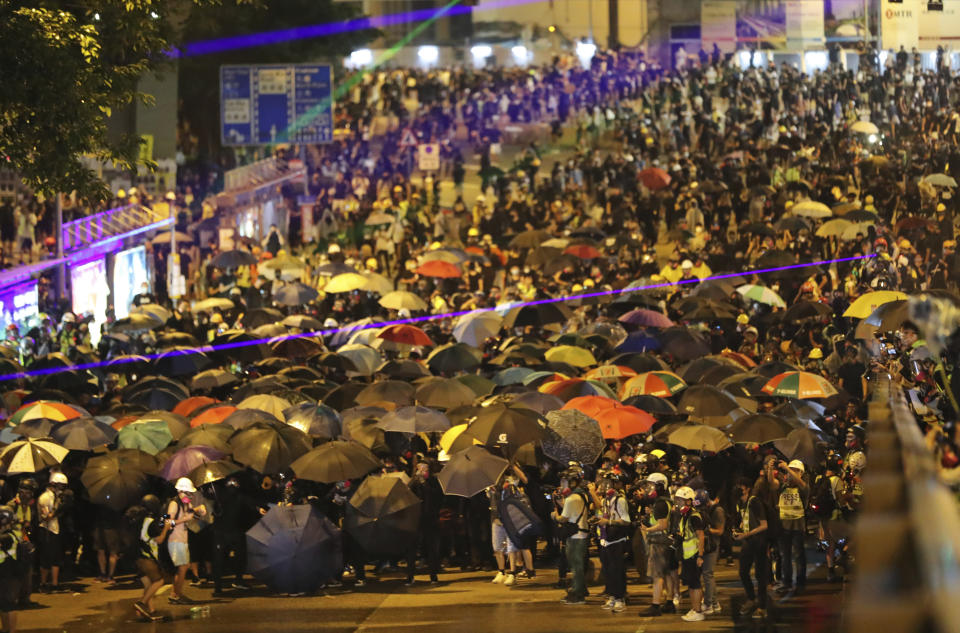 Protestors crowd a street in Hong Kong, Saturday, Sept. 28, 2019. A pro-democracy rally in downtown Hong Kong has ended early amid sporadic violence, with police firing tear gas and a water cannon after protesters threw bricks and Molotov cocktails at government offices. (AP Photo/Vincent Thian)