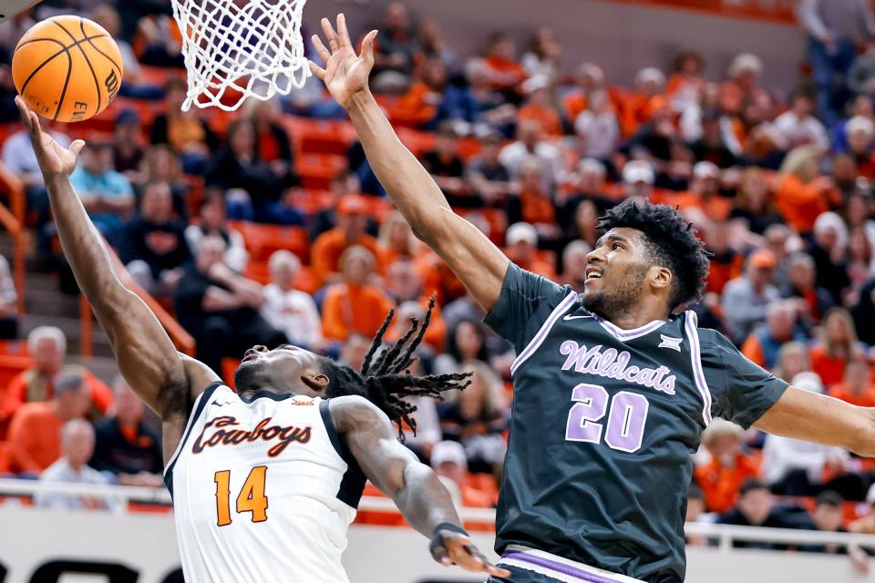 Oklahoma State guard Jamyron Keller (14) lays up the ball past Kansas State forward Jerrell Colbert (20) in the first half during an NCAA basketball game between Oklahoma State (OSU) and Kansas State (KSU) at the Gallagher-Iba Arena in Stillwater Okla., on Saturday, Feb. 3, 2024.