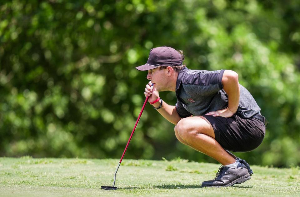 Lake Travis' Ethan Dufresne lines up his ball at the 15th hole at the UIL Class 6A boys state championship at White Wing Golf Club in Georgetown on Tuesday. The Cavaliers ended Westlake's six-year run as state champions, taking the fifth state title in school history.