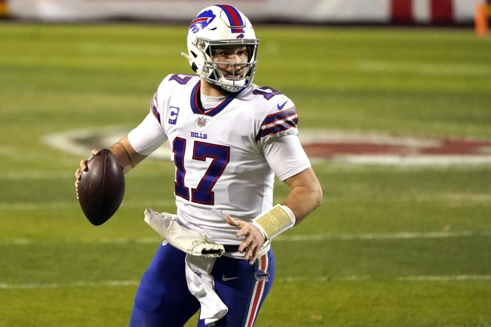 Buffalo Bills quarterback Josh Allen sets to throw a pass.