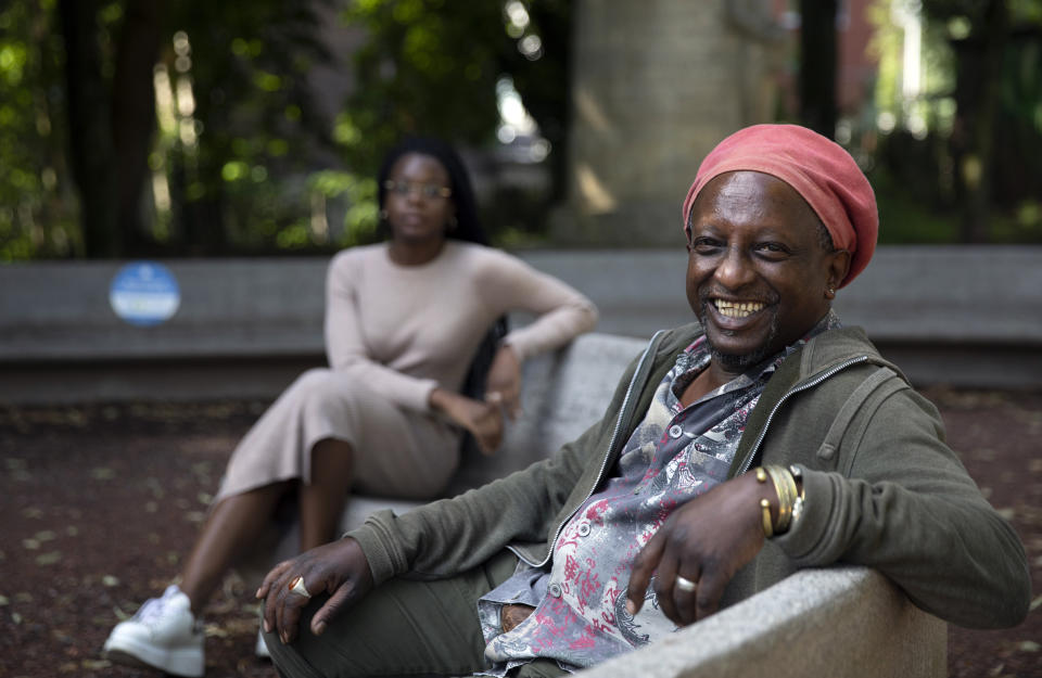 In this photo taken on Monday, June 22, 2020, Eric Baranyanka, right, and Eunice Yahuma pose for a photo in Halle, Belgium. In Halle, a small trading town of 40,000, as across much of Europe, the tide is turning and a new consciousness is taking shape in the wake of the Black Lives Matter movement in the United States. (AP Photo/Virginia Mayo)