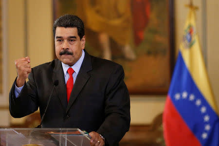 Venezuela's President Nicolas Maduro gestures as he talks to the media during a news conference in Caracas, Venezuela February 15, 2018. REUTERS/Marco Bello