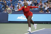 Serena Williams returns to Daria Gavrilova, of Australia, in the first round at the Western & Southern tennis Open, Monday, Aug. 13, 2018, in Mason, Ohio. (AP Photo/John Minchillo)