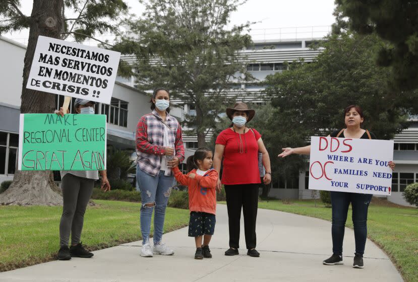 COSTA MESA CA - SEPTEMBER 29, 2022: Orange County families gather in protest over disability services targeting the California Department of Developmental Services and the Regional Center of Orange County, in Costa Mesa on September 29, 2022. (Christina House / Los Angeles Times)