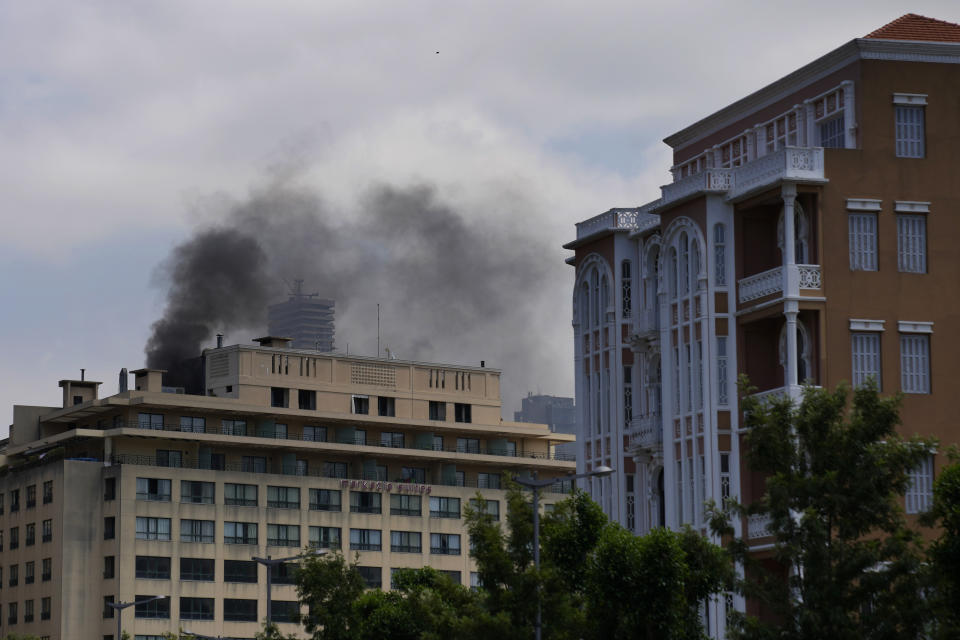 Smokes rises from the roof of a hotel after their privately-owned diesel generator catches fire in Beirut, Lebanon, July 12, 2022. Private generators are ubiquitous in parts of the Middle East, spewing hazardous fumes into homes and business across the country, almost 24 hours a day. As the world looks for renewable energy to tackle climate change, Lebanon, Iraq, Gaza and elsewhere rely on diesel-powered private generators just to keep the lights on. The reason is state failure: In multiple countries, governments can’t maintain a functioning central power network, whether because of war, conflict or mismanagement and corruption. (AP Photo/Hassan Ammar)