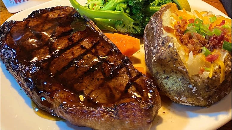 Outback Steakhouse steak on plate with potato