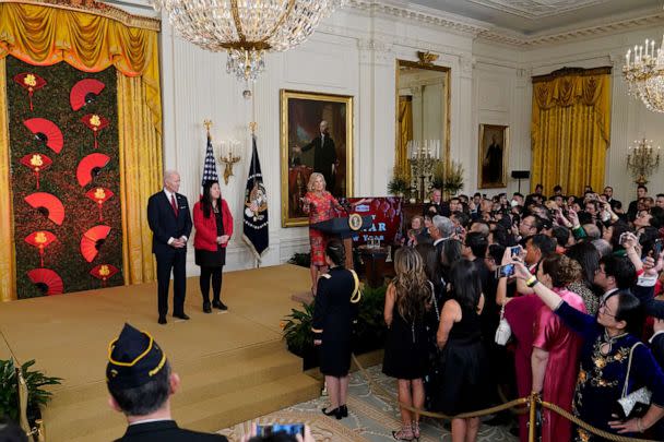 PHOTO: First lady Jill Biden speaks as President Joe Biden and Elaine Tso, CEO of Asian Services in Action, listen during a reception to celebrate the Lunar New Year in the East Room of the White House in Washington, Jan. 26, 2023. (Susan Walsh/AP)