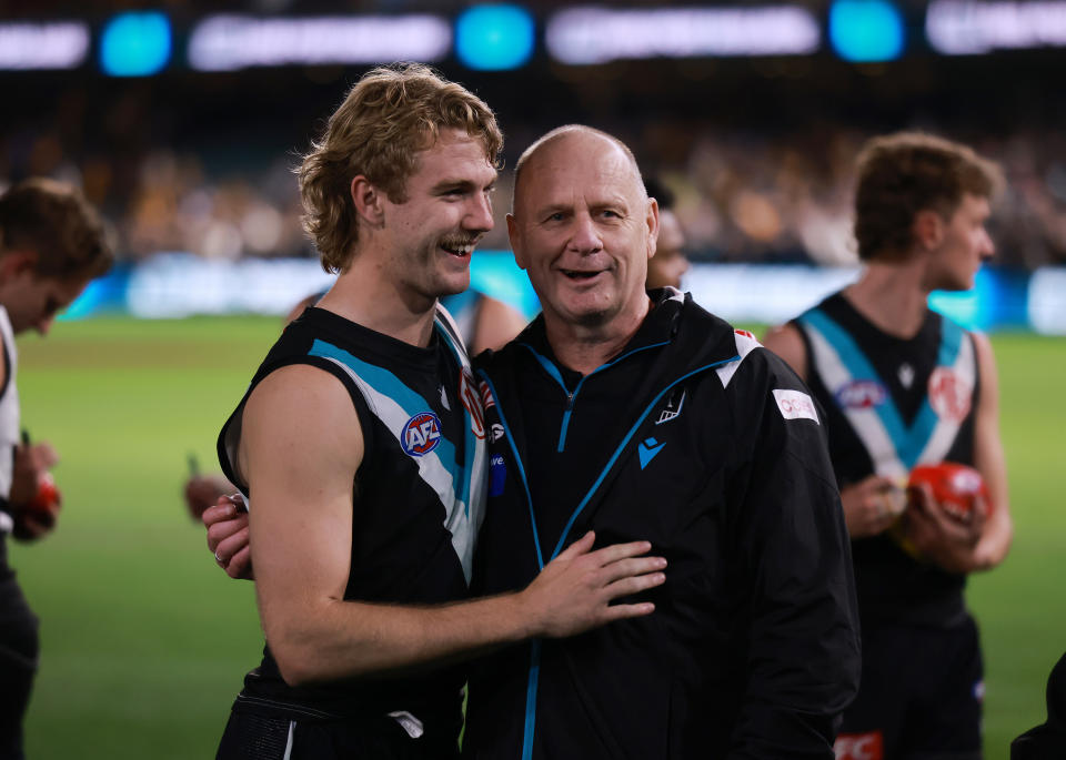 Jason Horne-Francis and Ken Hinkley embrace.