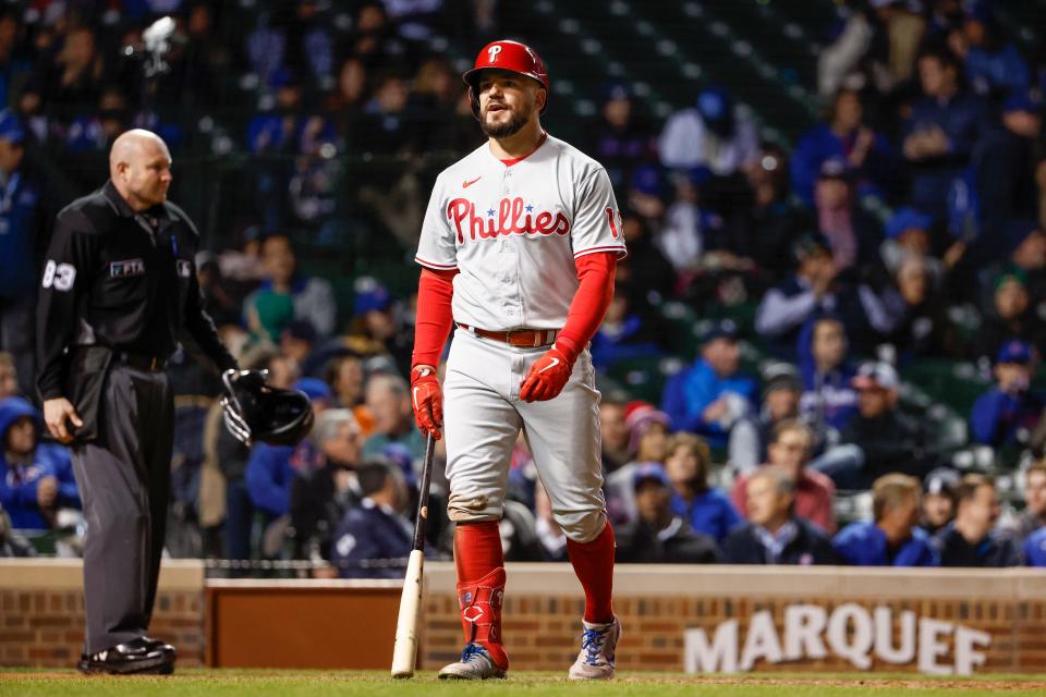 Phillies outfielder Kyle Schwarber walks off after striking out against the Cubs.