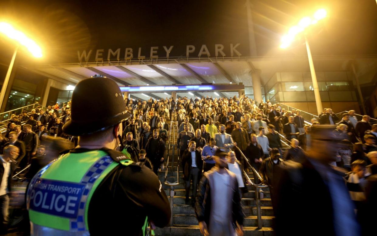 Fans make their way to Wembley in 2018. Some will be back for an FA Cup semi-final and the final, as well as the League Cup final, in new Covid passport trial schemes