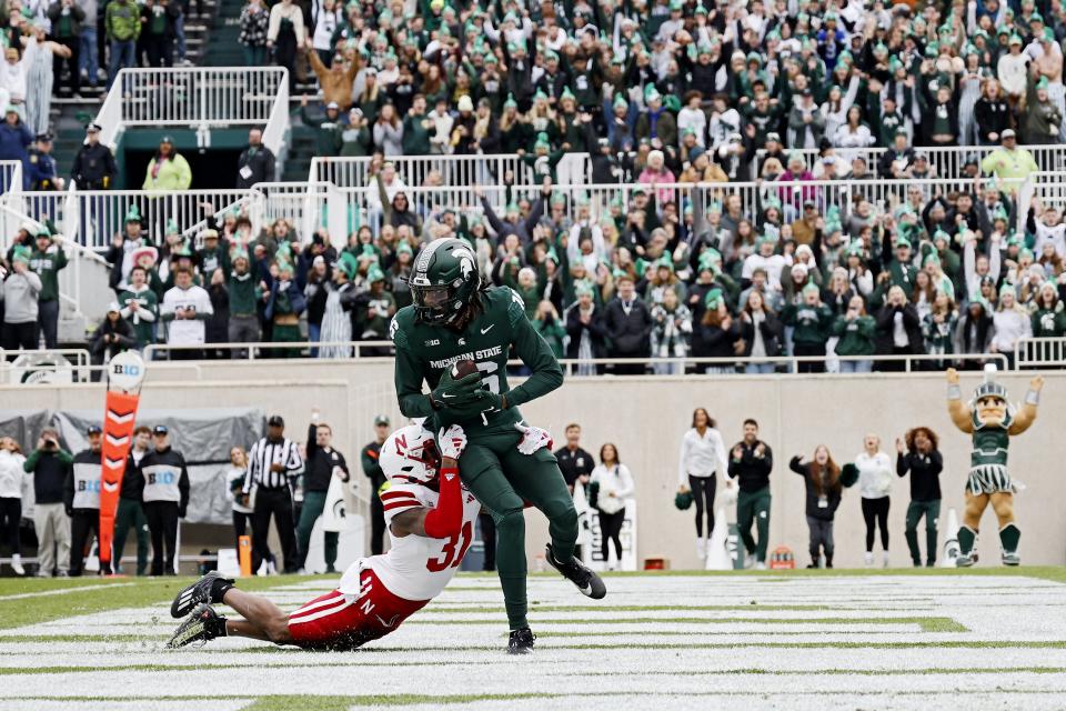 Michigan State wide receiver Christian Fitzpatrick catches a touchdown against Nebraska's Tommi Hill in the second quarter on Saturday, Nov. 4, 2023, in East Lansing.