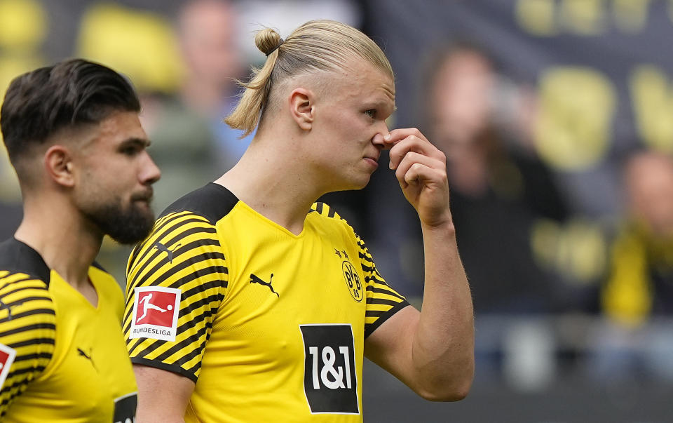 Dortmund's Erling Haaland, right, reacts disappointed in front of their supporters after losing the German Bundesliga soccer match between Borussia Dortmund and VfL Bochum in Dortmund, Germany, Saturday, April 30, 2022. (AP Photo/Martin Meissner)