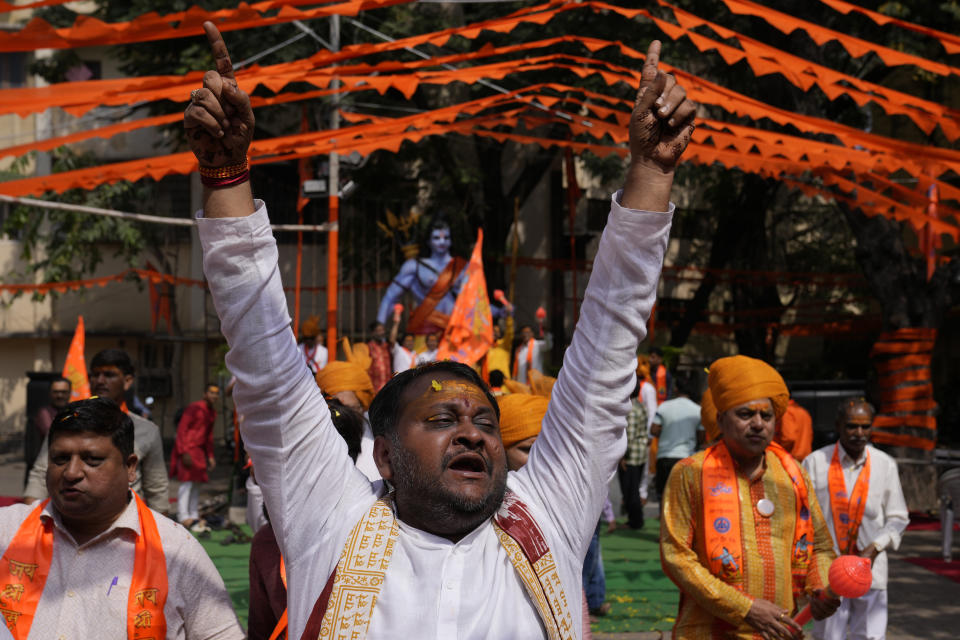 A Hindu devotee chants hymns at a religious procession in Hyderabad, India, during the inauguration of a temple dedicated to the Hindu Lord Ram in Ayodhya, Monday, Jan. 22, 2024. Indian Prime Minister Narendra Modi on Monday opened a controversial Hindu temple built on the ruins of a historic mosque in the holy city of Ayodhya in a grand event that is expected to galvanize Hindu voters in upcoming elections. (AP Photo/Mahesh Kumar A.)