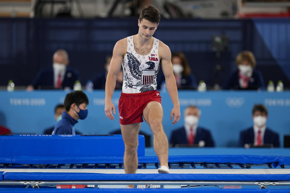 Aliaksei Shostak, of United States, reacts after falling during in the men's trampoline gymnastics qualifier at the 2020 Summer Olympics, Saturday, July 31, 2021, in Tokyo. (AP Photo/Natacha Pisarenko)