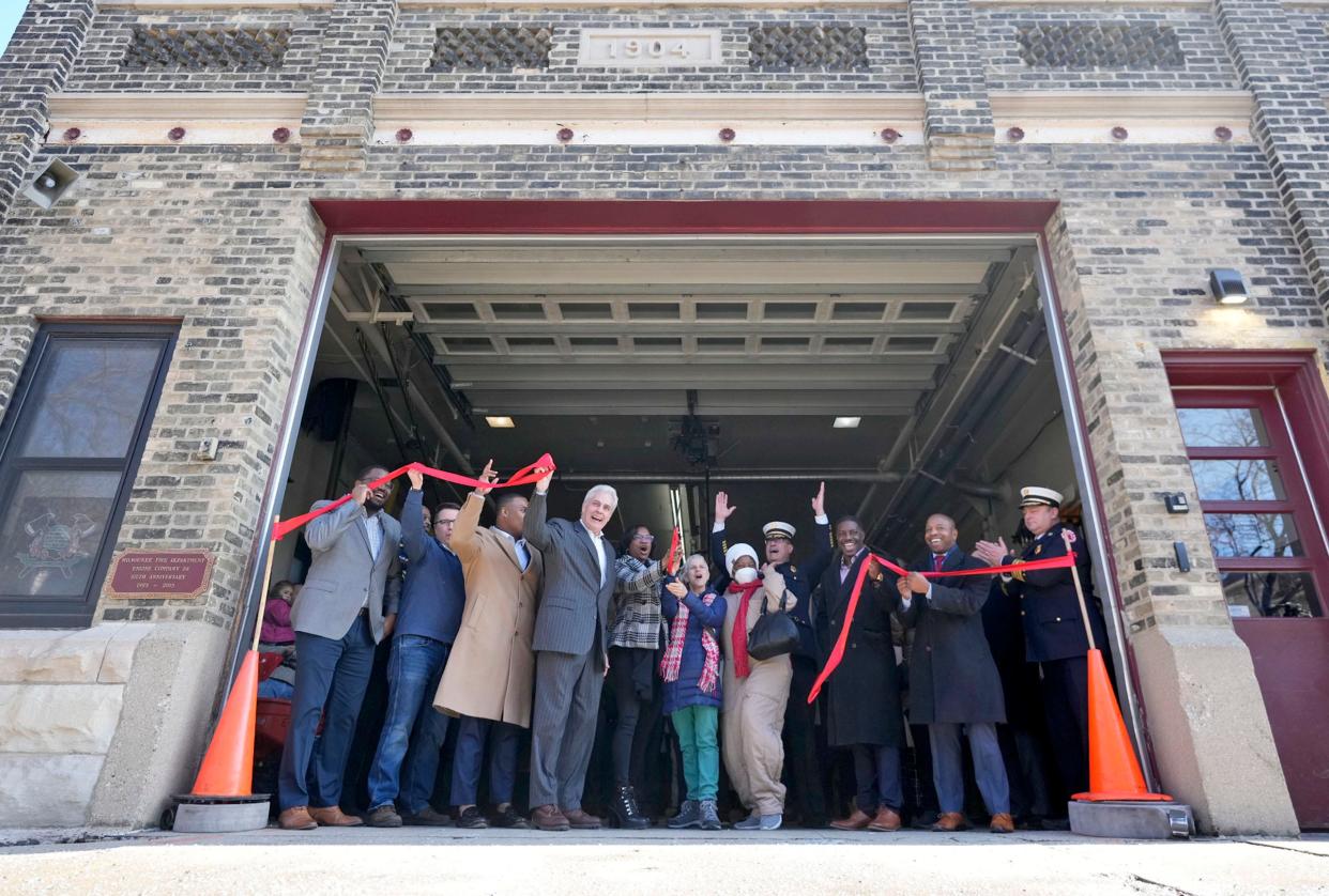 City officials and community members including (from 4th left) Ald. Bob Bauman, Sharlen Moore, director of Urban Underground and a member of Merrill Park Neighbors, Barb Scotty, community engagement coordinator for Near West Side Partners, Valerie Langston, a Merrill Park resident, Milwaukee Fire Department Chief, Aaron Lipski, Milwaukee County Supervisor, David Crowley, and Mayor Cavalier Johnson, celebrate the ribbon cutting during a Milwaukee Fire Department ceremony commemorating the recommissioning of Engine Company 28 on 424 North 30th Street in Milwaukee on Monday, Jan. 23, 2023. It’s the first fire station added to the Milwaukee Fire Department since 1956.