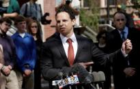 Attorney Josh Koskoff speaks to the media as family members of victims of the Sandy Hook Elementary School shooting stand behind him before a hearing at the Fairfield County Courthouse in Bridgeport, Connecticut, U.S., June 20, 2016, where the maker of the gun used in the 2012 massacre of 26 young children and educators at the Connecticut elementary school will ask a judge to toss a lawsuit saying the weapon never should have been sold to a civilian. REUTERS/Mike Segar