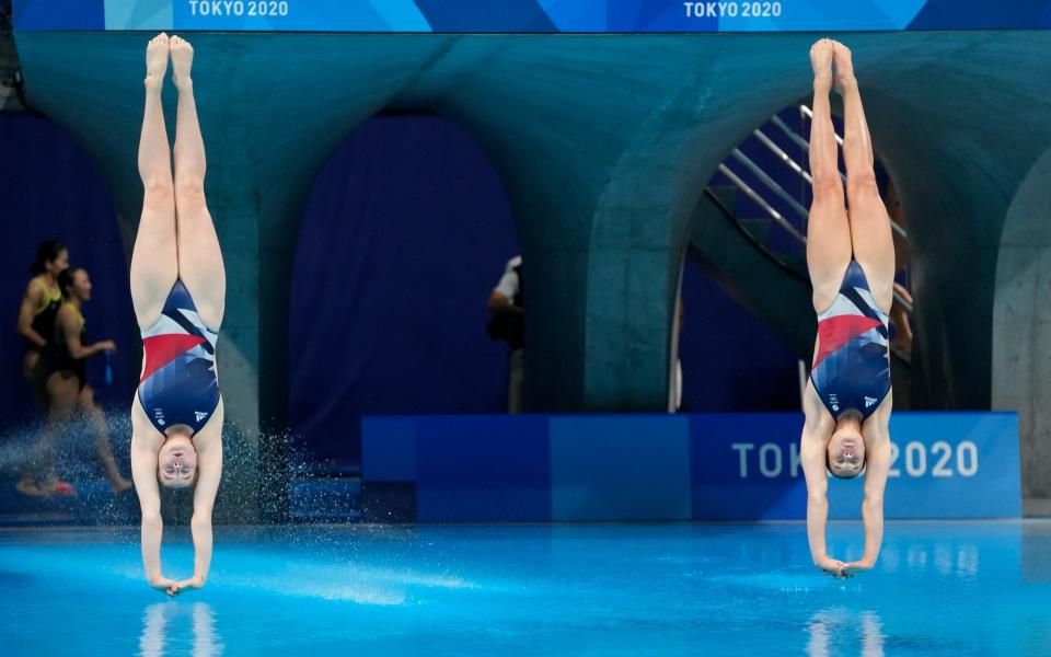 Grace Reid and Katherine Torrance of Britain compete during the Women's Synchronized 3m Springboard Final a - AP Photo/Dmitri Lovetsky