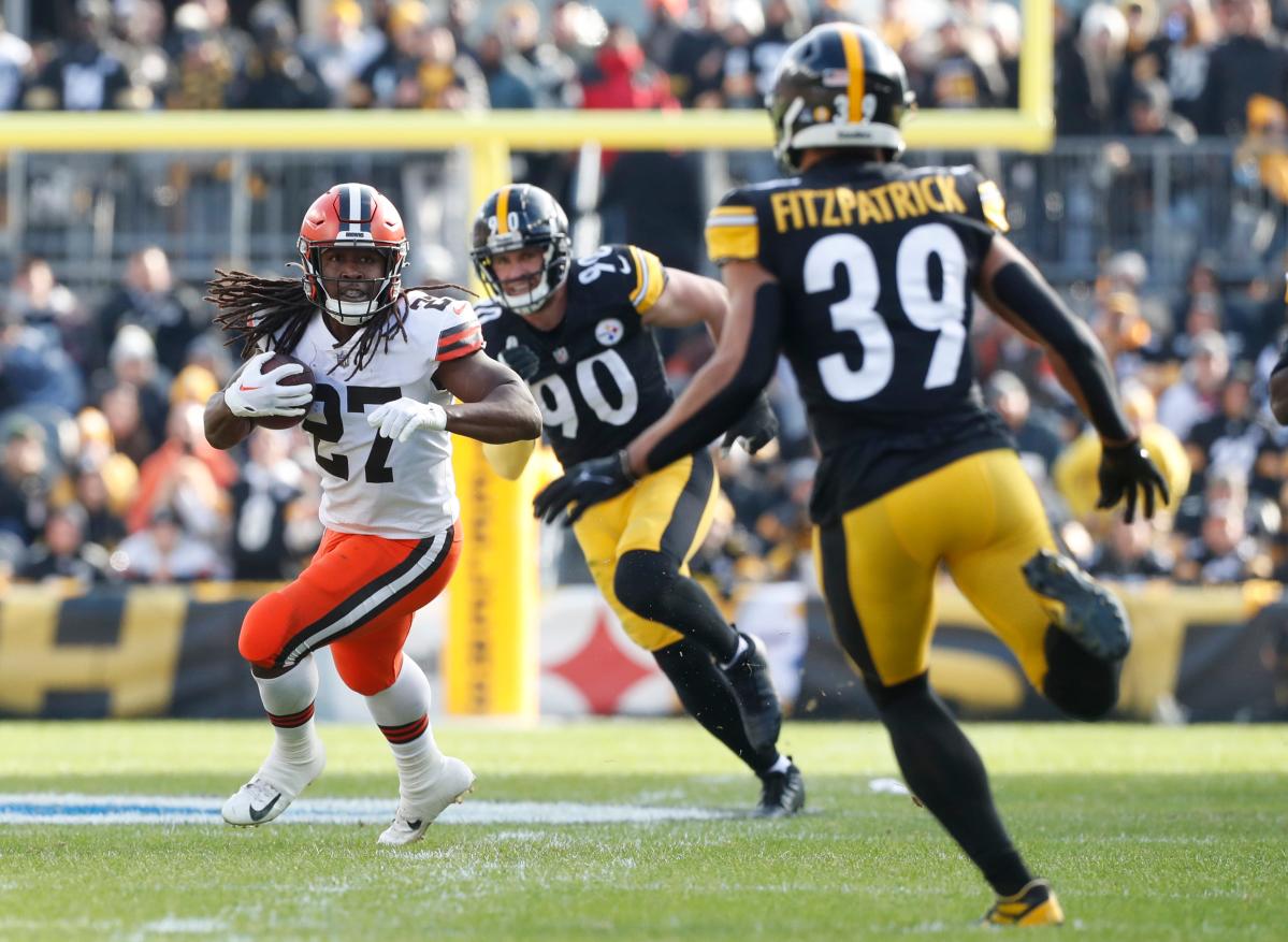 Jan 8, 2023; Pittsburgh, Pennsylvania, USA; Cleveland Browns running back Kareem Hunt (27) runs after catch as Pittsburgh Steelers linebacker T.J. Watt (90) and safety Minkah Fitzpatrick (39) chase during the second quarter at Acrisure Stadium. Mandatory Credit: Charles LeClaire-USA TODAY Sports (Miami Dolphins)
