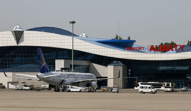 FILE PHOTO: An Air Astana plane is seen on the tarmac next to the terminal of Almaty International Airport, Kazakhstan