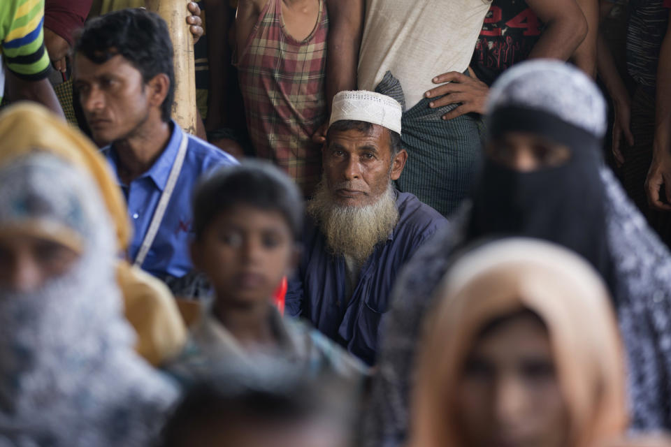 Rohingya refugees wait for news on the repatriation process at Unchiprang refugee camp near Cox's Bazar, in Bangladesh, Thursday, Nov. 15, 2018. The head of Bangladesh's refugee commission said plans to begin a voluntary repatriation of Rohingya Muslim refugees to their native Myanmar on Thursday were scrapped after officials were unable to find anyone who wanted to return. (AP Photo/Dar Yasin)