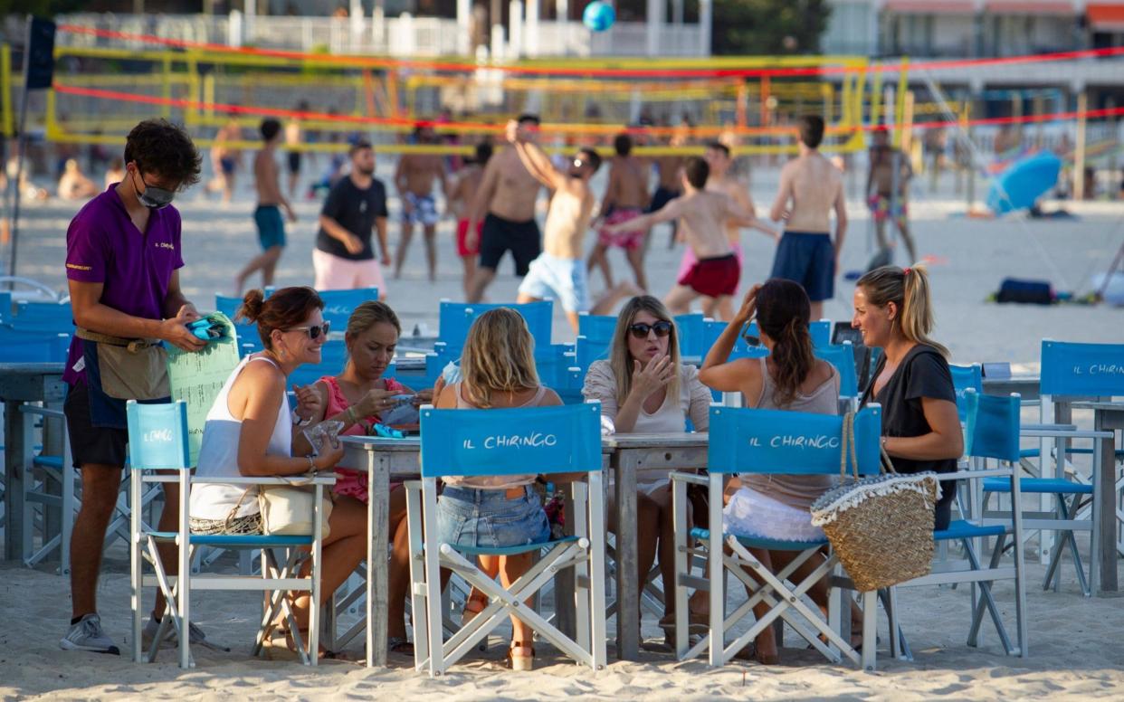 Visitors to Palmanova beach in Mallorca on Monday - GETTY IMAGES
