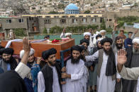 Mourners carry the body of a victim of a mosque bombing in Kabul, Afghanistan, Thursday, Aug. 18. 2022. A bombing at a mosque in Kabul during evening prayers on Wednesday killed at least 10 people, including a prominent cleric, and wounded over two dozen, an eyewitness and police said. (AP Photo/Ebrahim Noroozi)