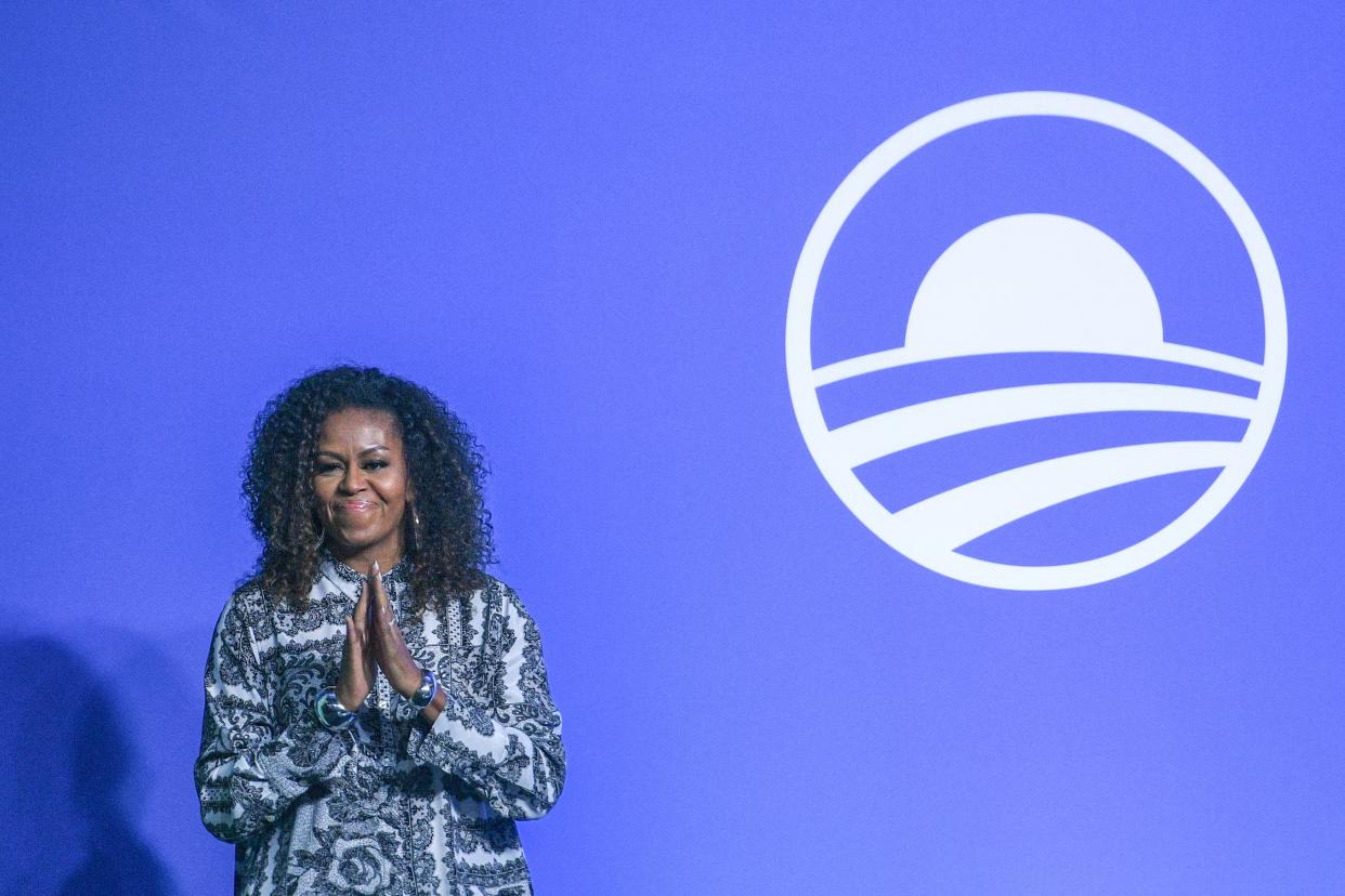 Former US first lady Michelle Obama gestures as she arrives to attend an event for the Obama Foundation in Kuala Lumpur on December 12, 2019. (Photo by Mohd RASFAN / AFP) (Photo by MOHD RASFAN/AFP via Getty Images)