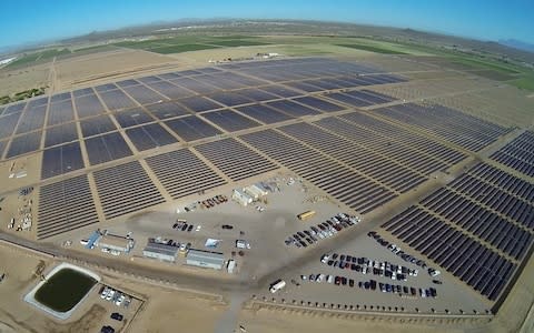 Apple's 50-megawatt solar farm, east of Appleâ€™s data center in Mesa, Arizona is pictured in this undated handout photo obtained by Reuters  - Credit: Reuters