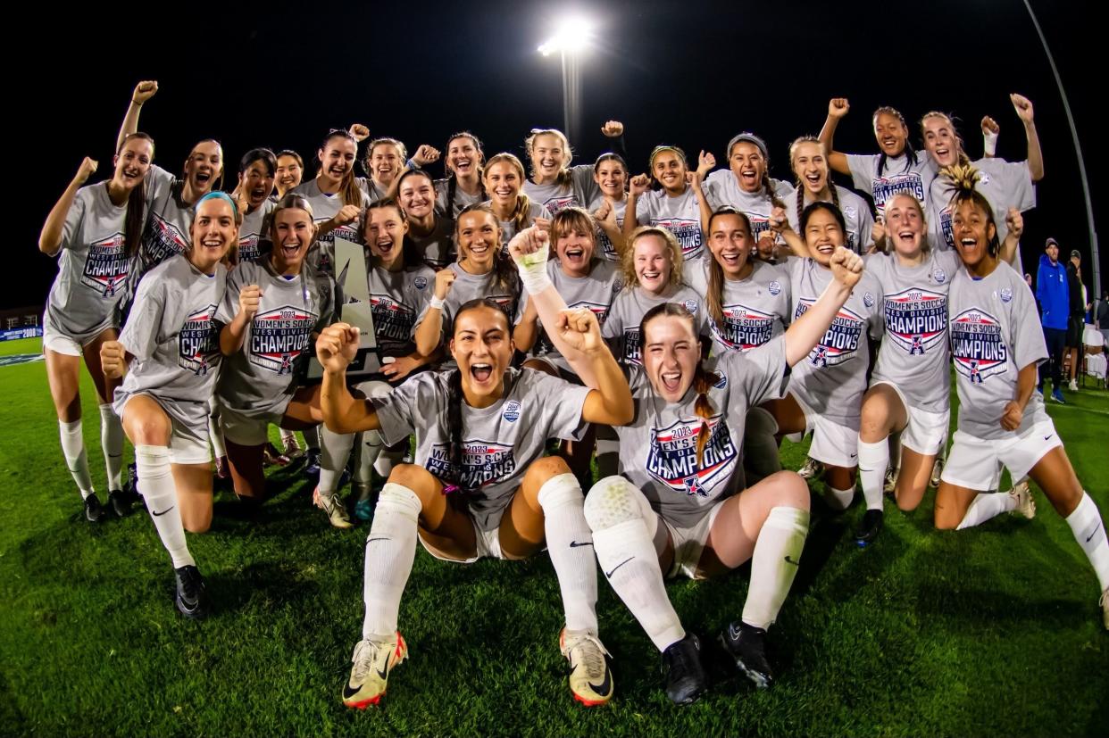 Memphis women's soccer celebrates winning the 2023 AAC West Division title.