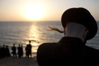 <p>Ultra-Orthodox Jews of the Hassidic sect Vizhnitz gather on a hill overlooking the Mediterranean sea as they participate in a Tashlich ceremony in Herzeliya, Israel, Sept. 12, 2013. (Photo: Oded Balilty/AP) </p>