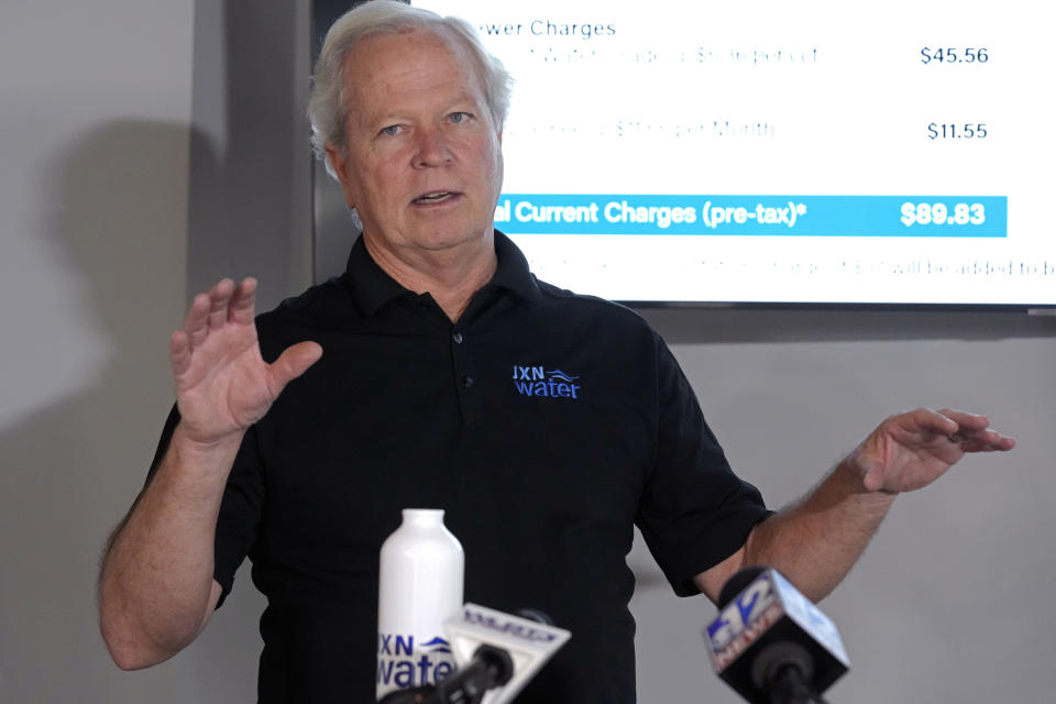 FILE - Ted Henifin, interim third-party manager for JXN Water, the water system for the city of Jackson, Miss., explains his proposal for a slight rate increase Friday, Nov. 17, 2023, during a news conference in Jackson. The day after Mississippi health officials told residents in the state’s capital that dangerous bacteria could be in their tap water, a new round of test results did not find E. coli in the city's supply, Henifin, the city's water manager said Friday, Jan. 12, 2024. (AP Photo/Rogelio V. Solis)