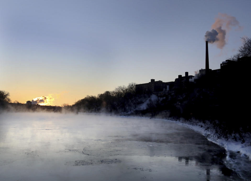 Steam rises from the Mississippi River along West River Parkway, Thursday, Feb. 13, 2020, near downtown Minneapolis, as temperatures hover near minus 30 degrees Fahrenheit with wind chills. (David Joles/Star Tribune via AP)