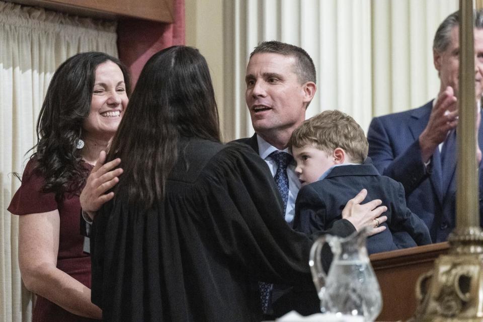 Mike McGuire is congratulated after being sworn in as Senate President Pro Tempore