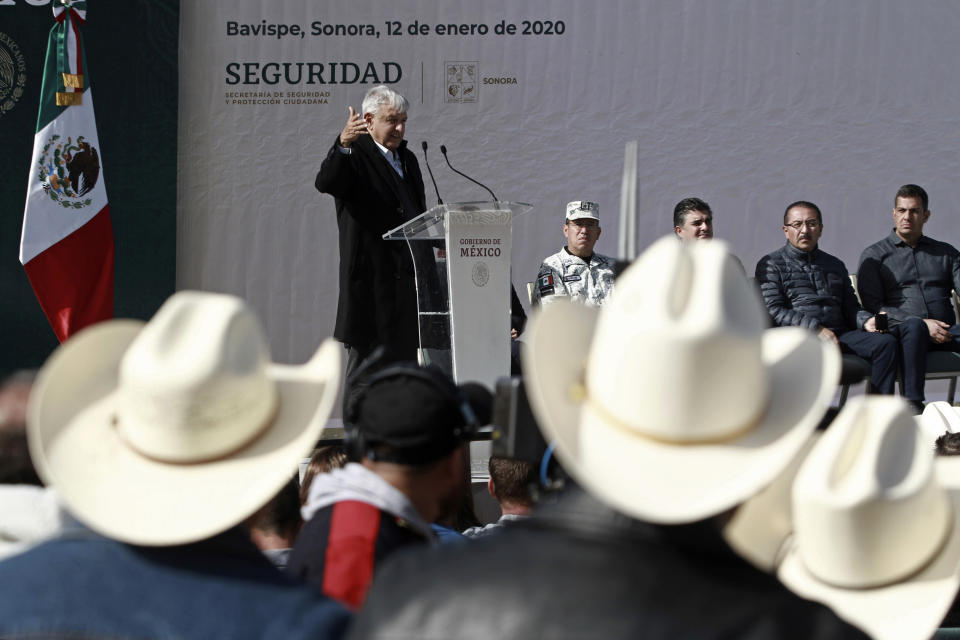 Mexico's President Andres Manuel Lopez Obrador speaks during his visit to the small town of La Mora, Sonora state, Mexico, Sunday Jan. 12, 2020. Lopez Obrador said Sunday there is an agreement to establish a monument will be put up to memorialize nine U.S.-Mexican dual citizens ambushed and slain last year by drug gang assassins along a remote road near New Mexico. (AP Photo/Christian Chavez)